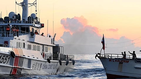 A Chinese Coast Guard vessel (left) tries to block a supply boat delivering provisions to the grounded Philippine Navy vessel BRP Sierra Madre at Second Thomas Shoal in the South China Sea