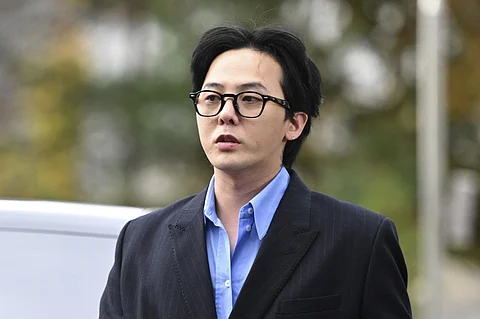 K-pop star G-Dragon arrives at a police station for his police questioning in Incheon on 6 November 2023. (Photo by Jung Yeon-je / AFP)