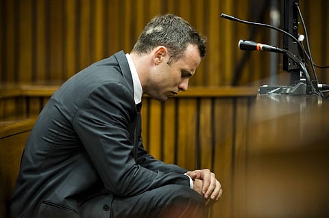 (FILES) South African paralympic athlete Oscar Pistorius (Photo by POOL / AFP)
