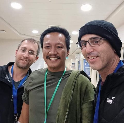 JIMMY Pacheco (center) gets a visit from the grateful sons of Amitai Ben Zvi after his release from captivity by the Hamas extremist group. Pacheco served as the healthcare aide of Zvi before the latter’s murder by the terrorists. | PHOTOGRAPH COURTESY OF ISRAEL EMBASSY FB PAGE