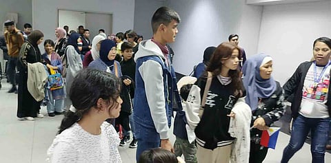 Filipino repatriates arrive from Gaza with their children and spouses