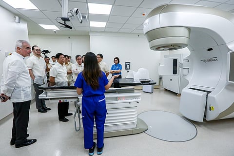 Healthcare leap President Ferdinand R. Marcos Jr. listens to a healthcare personnel about the Linear Accelerator machine at Friday’s inaugural event of the Healthway Cancer Care Hospital in Taguig City. The Ayala-owned HCCH is a significant leap in cancer patient care. With Marcos are Ayala Healthcare Holdings, Inc. (AC Health) chairman Fernando Zobel de Ayala, AC Health president and CEO Paolo F. Borromeo, Health Secretary Teodoro J. Herbosa, and Radiation oncologist Dr. Boy Vega. | Noel B. Pabalate/PPA POOL