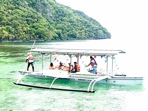 The renewable energy-powered sea vessel prepares for its maiden voyage off the waters in Coron town, Northern Palawan on Wednesday. The banca is seen to provide transportation and other services to island communities, as well as advance a low-carbon future for the Philippines. (Photo from USAID ESP / Diwata De Castro-Paredes)