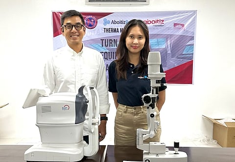 (FILES) Navotas City Mayor John Rey Tiangco (left) receives donations of new equipment from Therma Mobile Inc. and the Aboitiz Foundation,