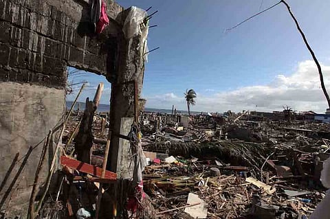FILE: The shoreline of Barangay Magallanes in Tacloban City is left in ruins Sunday after the storm surge last week brought by super typhoon Yolanda. The strongest typhoon to hit the country this year leveled villages as it crossed several provinces in the Visayas