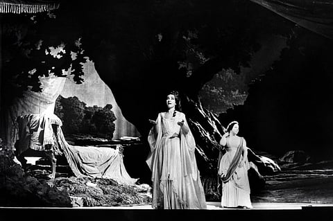 This photograph taken at the Paris Opera House on May 23, 1964, shows American singer of Greek origin Maria Callas (C) and Italian mezzo-soprano Giulietta Simionato (R) performing in the Bellini opera "Norma". 1Photo by AFP