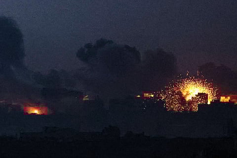 A picture taken from southern Israel near the border with the Gaza Strip on December 2, 2023, shows an explosion and smoke billowing over the Palestinian territory during an Israeli strike as battles resumed between Israel and Hamas militants. Photo by JACK GUEZ / AFP