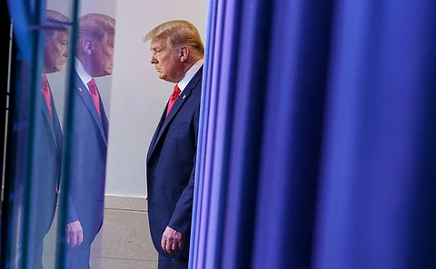 (FILES) US President Donald Trump arrives to deliver remarks on the stock market during an unscheduled appearance in the Brady Briefing Room of the White House in Washington, DC on 24 November 2020.