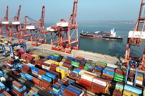 This photo taken on 6 December 2023 shows a cargo ship preparing to berth at the container terminal of Lianyungang Port in Chinas eastern Jiangsu Province. Chinese exports rose in November for the first time in seven months, officials said on 7 December, as the country navigates a troubled recovery from the COVID-19 pandemic. (Photo by AFP)