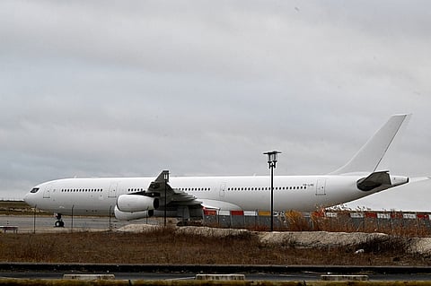 This photograph taken on December 23, 2023, shows the Airbus A340 which was grounded over suspected "human trafficking" at Vatry airport, north-eastern France. Photo by FRANCOIS NASCIMBENI / AFP