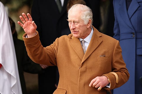 Britain's King Charles III waves to well-wishers after attending the Royal Family's traditional Christmas Day service at St Mary Magdalene Church on the Sandringham Estate in eastern England, on December 25, 2023. (Photo by Adrian DENNIS / AFP