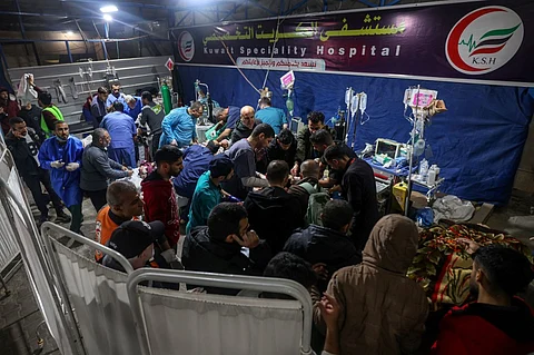 Victims of an Israeli army strike are taken in charge by medical staff at Kuwait hospital in Rafah in the southern Gaza Strip on December 28, 2023, as battles continue between Israel and the Palestinian Hamas movement. Photo by MOHAMMED ABED / AFP
