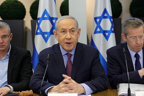 Israeli Prime Minister Benjamin Netanyahu (C) chairs a Cabinet meeting at the Kirya, which houses the Israeli Ministry of Defence, in Tel Aviv on 31 December, 2023. Netanyahu said Israel displayed unparalleled "morality" in the Gaza war and rejected South Africa's charge that it was committing "genocidal" acts in the Palestinian territory. (Photo by ABIR SULTAN / POOL / AFP)