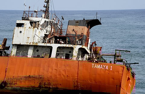 FILE PHOTO: A picture taken on 12 May 2016 shows an empty oil tanker that drifted onto the beach in Robertsport, western Liberia. (Photo by ZOOM DOSSO / AFP)