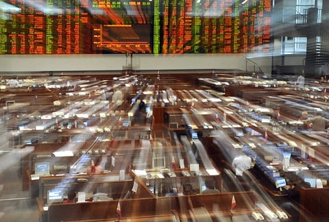 FILE PHOTO: Trading activity at the Philippine Stock Exchange in Manila's financial district of Makati is seen in a zoom shot. (Photo by ROMEO GACAD / AFP)