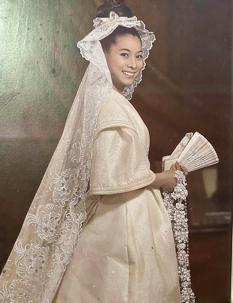 PHOTOGRAPH COURTESY OF BARGE RAMOS | TINGTING COJUANGCO FAMILY COLLECTION | THE young bride in Christian Espiritu’s ageless wedding gown masterpiece.