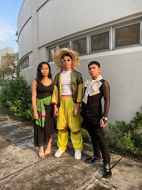 Benilde Fashion Design and Merchandising student Kristina Marie Mariano, Benilde Architecture student Brian Razon (right) and a model wear Simbang Gabi-inspired ensembles.