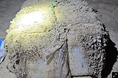 A first batch of 39 barnacle-encrusted, one-kilogram bricks of suspected cocaine was discovered near Magenta Beach, north of Sydney, police said. (Photo: New South Wales Police)