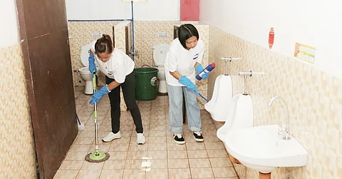 Domex volunteers cleaned the comfort room of Ricardo P. Cruz Sr. Elementary School, Taguig City, during ‘Brigada Eskwela’ 2023.