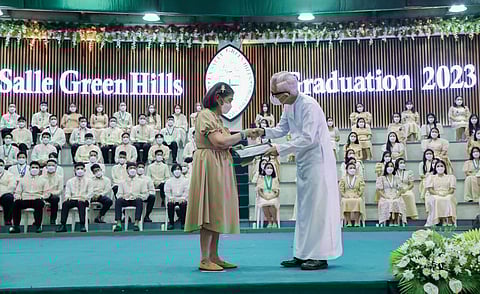 Nanay Letty with LSGH President Br. Edmundo Fernandez, FSC during the LSGH Commencement Exercises