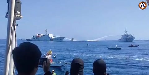 "Chinese Coast Guard ships utilized water cannons to obstruct and prevent BFAR vessels from approaching the Filipino fishing vessels eagerly awaiting the oil subsidy and grocery packs," said the National Task Force for the West Philippine Sea. | 📷 Philippine Coast Guard/@JayTaryela (X formerly Twitter)