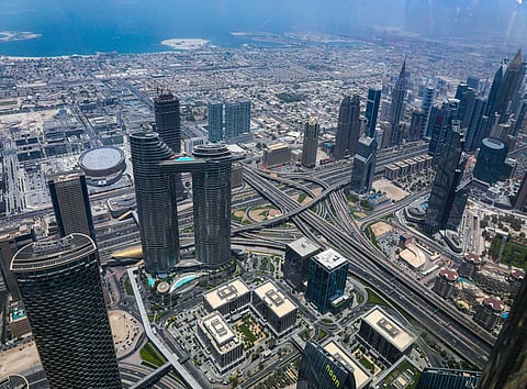 Photo credit to naveen kolli. An aerial view of Dubai skyline’s modern city near a coast.