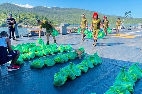 Navy personnel preparing Noche Buena packages aboard a Philippine Navy vessel in Puerto Princesa from the Atin Ito Coalition. (Photo from the Western Command)