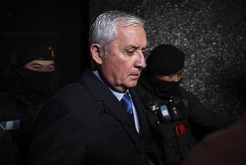 FILE PHOTO: Guatemalan former President (2012-2015), Otto Perez Molina, leaves the court after listening to his sentence during a hearing in Guatemala City, on 7 December 2022. (Photo by Johan ORDONEZ / AFP)