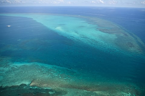 (FILE PHOTO) This photo taken on 28 September 2023 shows an aerial view of the mouth of the Chinese-controlled Scarborough Shoal.