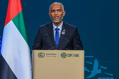 Maldives' President Mohamed Muizzu speaks during the High-Level Segment for Heads of State and Government session at the United Nations climate summit in Dubai on December 1, 2023. World leaders take centre stage at UN climate talks in Dubai on December 1, under pressure to step up efforts to limit global warming as the Israel-Hamas conflict casts a shadow over the summit. (Photo by KARIM SAHIB / AFP)