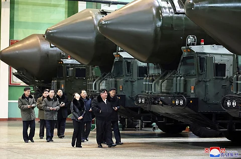 This undated picture released from North Korea's official Korean Central News Agency (KCNA) via KNS on January 5, 2024 shows North Korea's leader Kim Jong Un (2nd R) inspecting an important military vehicle production plant with his daughter Ju Ae (C) at an undisclosed location in North Korea. Photo by KCNA VIA KNS / AFP