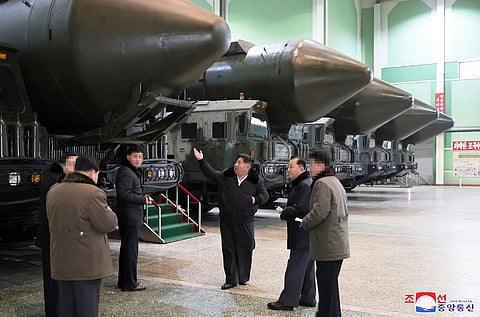This undated picture released from North Korea's official Korean Central News Agency (KCNA) via KNS on January 5, 2024 shows North Korea's leader Kim Jong Un (C) inspecting an important military vehicle production plant at an undisclosed location in North Korea. Photo by KCNA VIA KNS / AFP