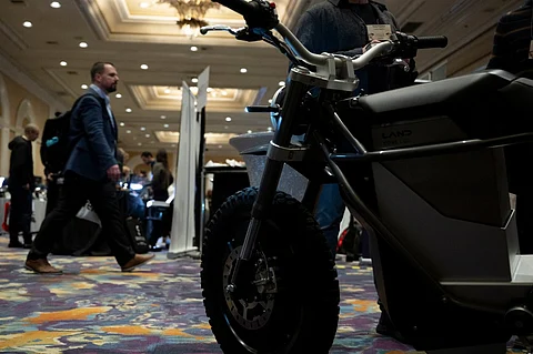 A man walks past an e-bike during Pepcom's Digital Experience at the The Mirage resort during the Consumer Electronics Show (CES) in Las Vegas, Nevada on January 8, 2024. Photo by Brendan Smialowski / AFP