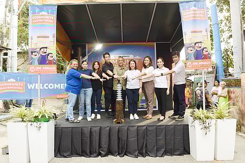 Residents of Loans Street in Barangay Sangandaan, Quezon City benefit from One Meralco Foundation’s Household Electrification Program, with representatives from Meralco and the Quezon City LGU leading the program launch: barangay captain Marivic Hefti, QC District 6 Councilors Doc Ellie Juan and Kristine Matias, QC Vice Mayor Gian Sotto, OMF president Jeffrey O. Tarayao, QC District 6 Congresswoman Marivic Co-Pilar, Meralco senior AVP and microbiz north business area head Margarita B. David, Meralco Commonwealth-Balintawak business center head Alleni O. Pascual and Meralco North metering services and security head Frederico Naniong Jr.(PHOTOGRAPH COURTESY OF Meralco)