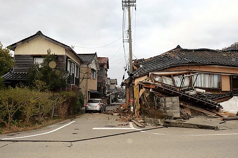 DAMAGED houses in the city of Wajima in the Ishikawa Prefecture of Japan show the severity of a series of earthquakes that hit the country on New Year’s Day. Left panel shows residents taking to the relative safety of the streets. | Yomiuri Shimbun/AGENCE FRANCE-PRESSE