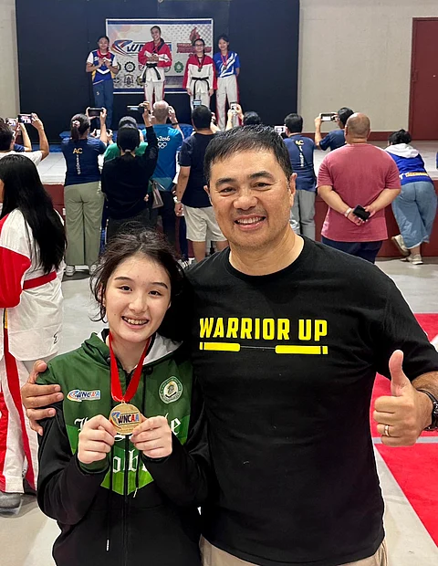 PHOTOGRAPH COURTESY OF MONSOUR DEL ROSARIO
ISABELLA del Rosario (left) is slowly stepping out of the giant shadow of his father, Monsour, following her impressive win in the taekwondo competition of the WNCAA.