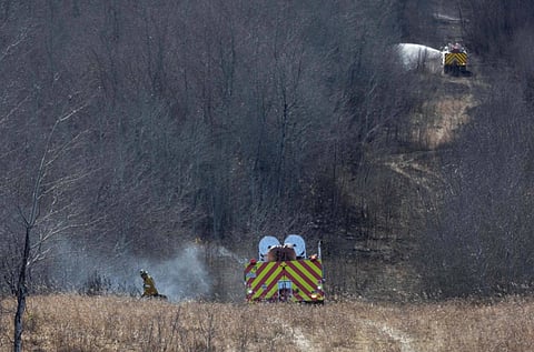 Firefighters are deployed near Canadian Forces Base Wainwright, where a fire killed four people and injured 39, in Wainwright, Alberta, on Oct. 18