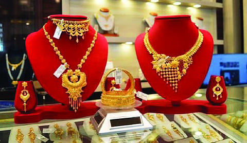 Gold holds steady, silver gains Rs 500/kg in Delhi
