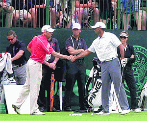 Garcia, Woods shake hands on green