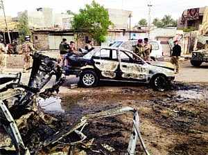 Car bomb and roadside bombings kill 18 in Iraq