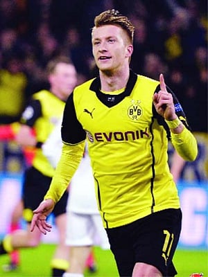 Real Madrid lose at Dortmund but qualify