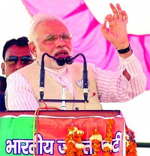 Proud of RSS ideology of sacrifice, Modi retorts Rahul