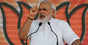 Modi uses Baru book to hit out against Sonia, Rahul