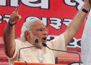 Modi dares EC to act against him