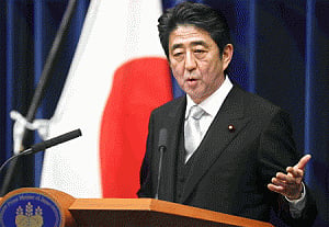 Japan's government approves larger military role
