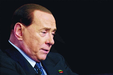 Berlusconi cleared of underage sex charge