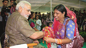 Women, children tie rakhi on Modi's wrist