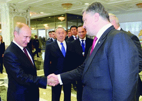 Vladimir Putin sits down with Ukrainian Prez for talks