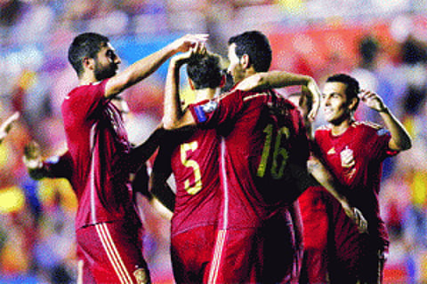 Spain crush Macedonia, England make winning start
