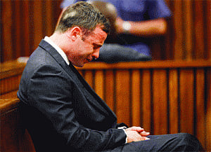 Cleared of murder charges, Pistorius awaits verdict